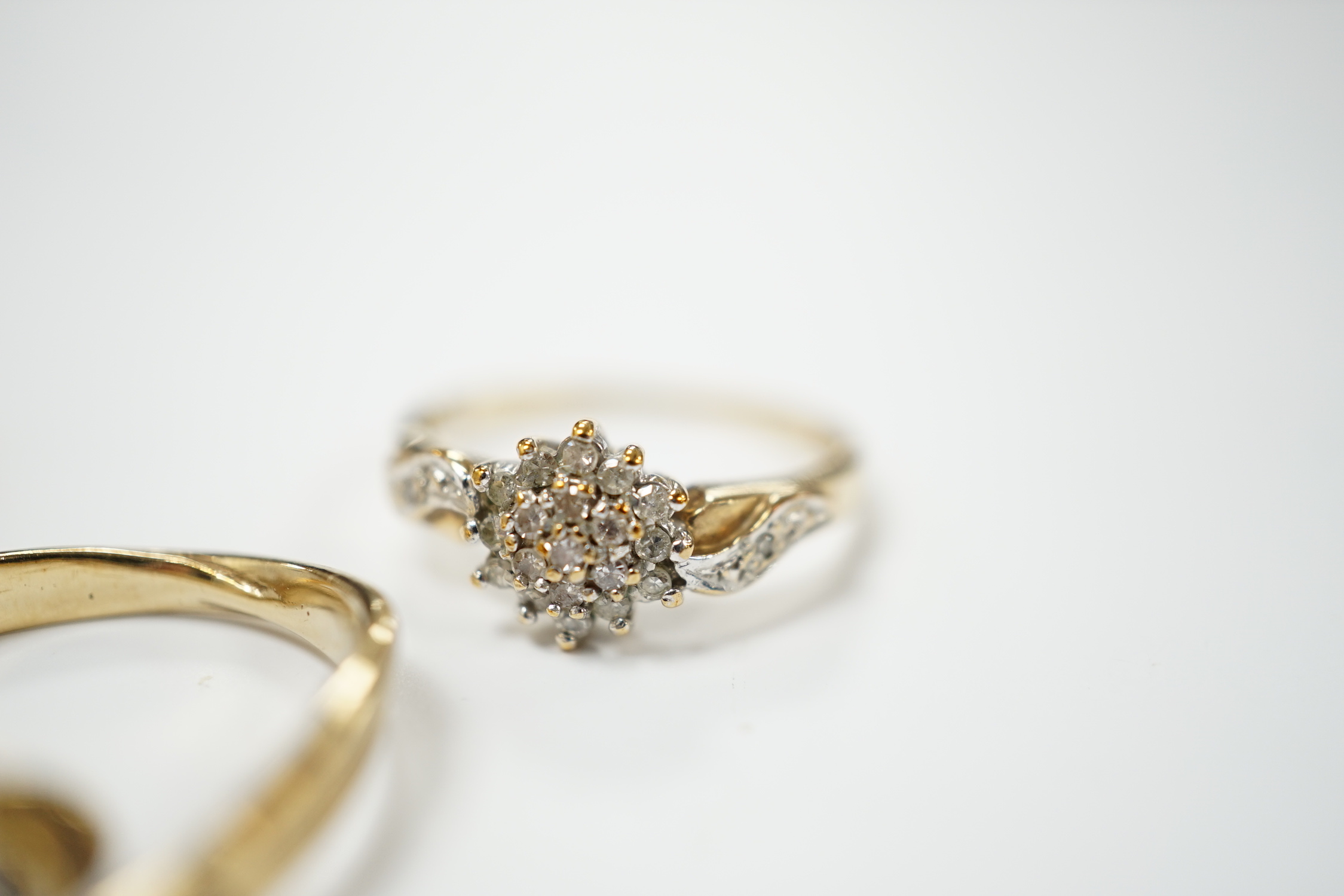 Three modern 9ct gold and diamond set rings, including solitaire and cluster, gross weight 5.9 grams.